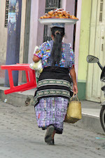 Photo: Woman carrying her stuff, © by Harry Griswold